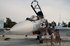 Russian pilots climb to their Su-30 jet at Hemeimeem airbase, Syria